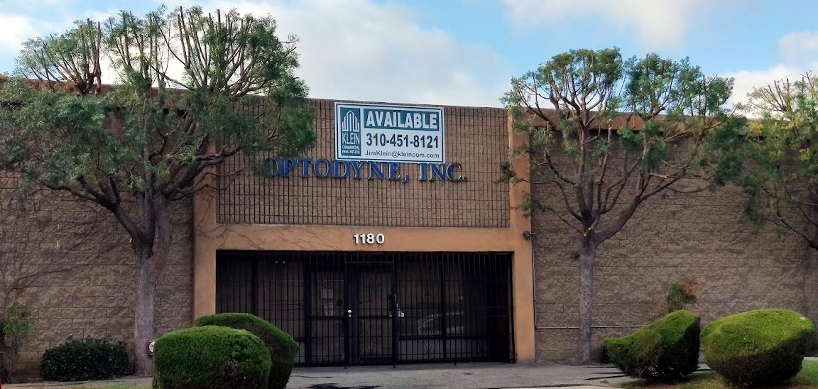 front view of 1180 Mahalo Place with trimmed trees and Klein Commercial sign